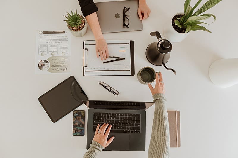 Flatlay of business tools and content creation props to strategically use in client-facing communication