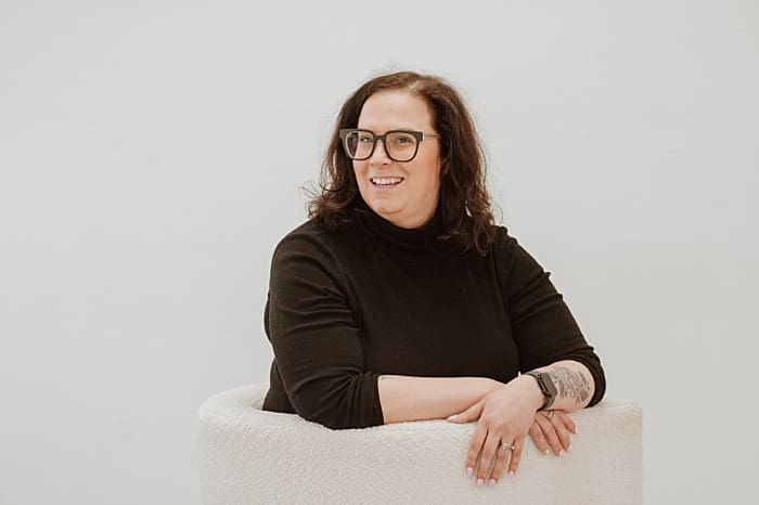 female entrepreneur sitting in chair
