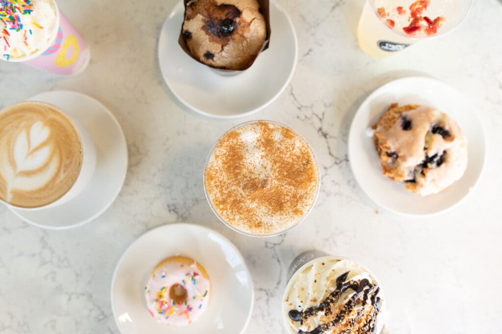 Top down view of gluten free baked goods and coffees