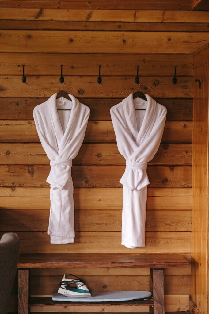 Two robes hanging at the entrance of the resort cabin at Sandpiper Resort